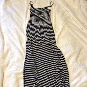 Black and white striped tight fitted maxi dress with leg slit